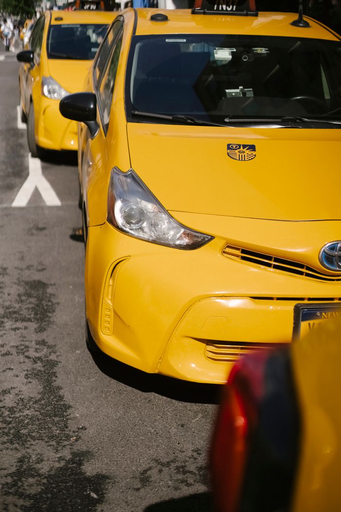The Art of Drawing Readers In: Your attractive post title goes here From above of bright yellow modern sports cab cars parked on urban roadway in sunlight